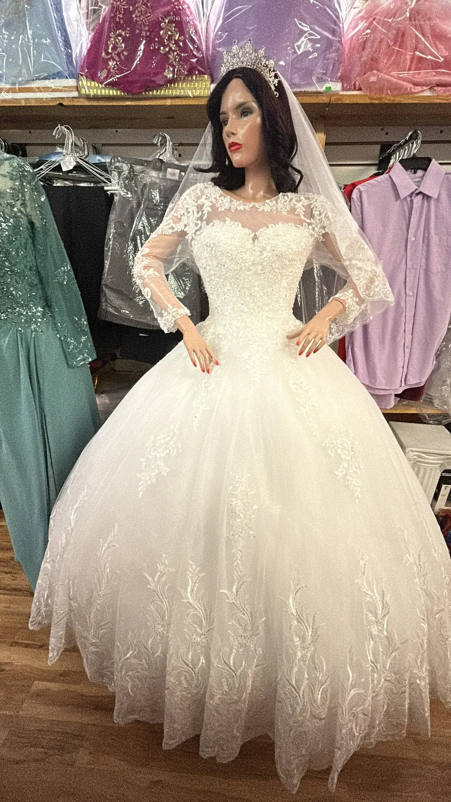 Lace long-sleeve wedding gown with veil