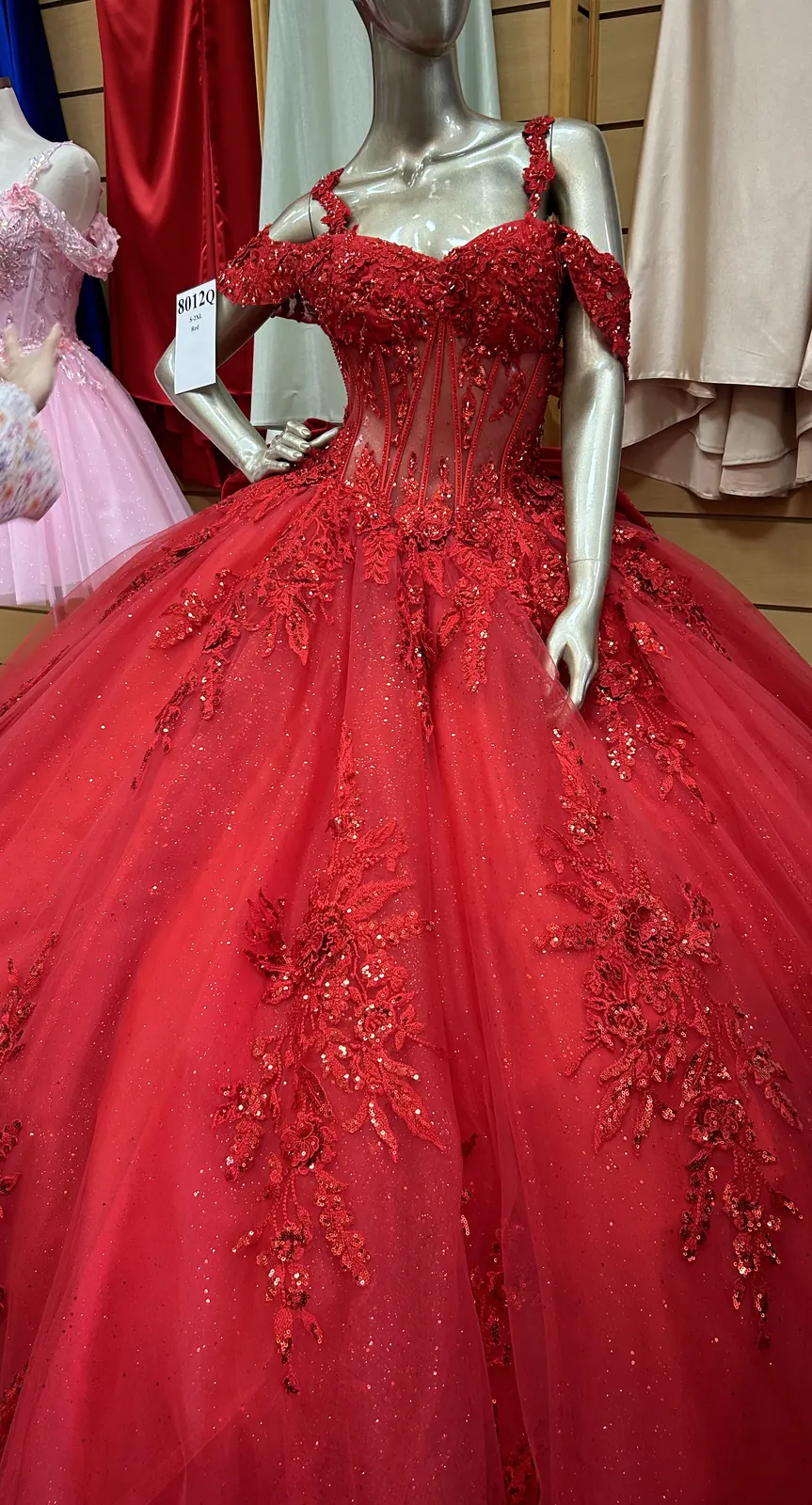 Red quinceañera dress with sequin appliqué